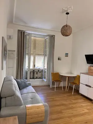 a living room with a couch and a table at Simply the best! All you need! in Nice