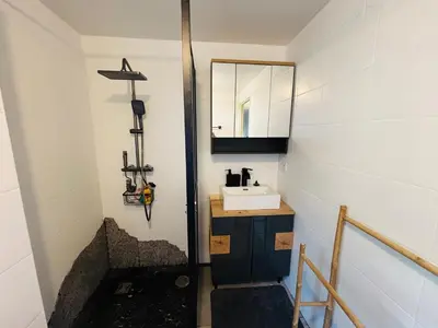 a bathroom with a sink and a mirror at Magnifique studio avec terrasse et jardin in Nice