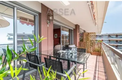 a balcony with a table and chairs on a balcony at Absea Nice Belles Terres 4 in Nice