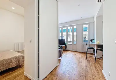 a bedroom with a bed and a desk in a room at Nestor&Jeeves - GOLDEN SQUARE - Near Promenade des Anglais in Nice
