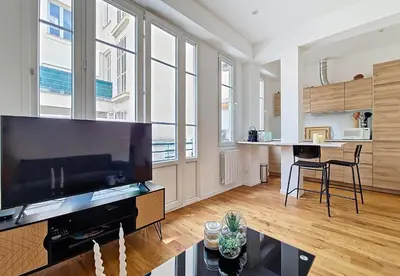 a living room with a large flat screen tv at Nestor&Jeeves - GOLDEN SQUARE - Near Promenade des Anglais in Nice