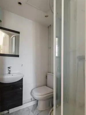 a bathroom with a toilet and a sink and a shower at Studio cosy dans une belle copropriete classee in Nice