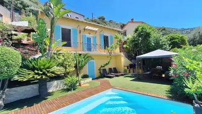 a villa with a swimming pool in a garden at Villa in Nice French Riviera in Nice