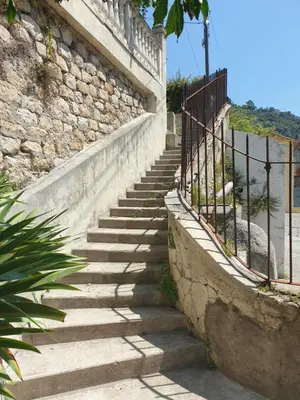 a set of stairs next to a stone wall at Villa in Nice French Riviera in Nice
