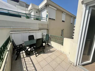 a patio with chairs and a table on a balcony at Nice Signature Halevy Terrasse in Nice