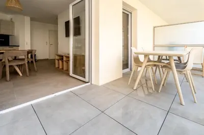 a kitchen and dining room with a table and chairs at Le Bô Mont in Nice