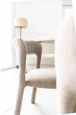 a chair in a room with a lamp at Le Bô Mont in Nice