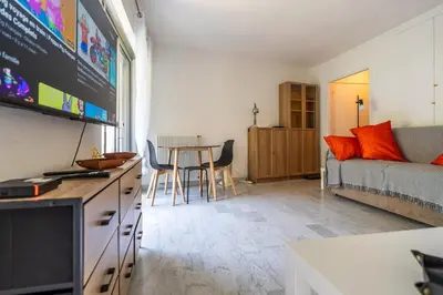 a living room with a couch and a table at L'Échappée Belle in Nice