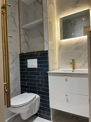 a bathroom with a toilet and a sink and a mirror at MOON - 31 in Nice