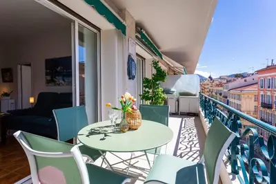 a balcony with a table and chairs on a balcony at LE LAFAYETTE AP4410 By Riviera Holiday Homes in Nice