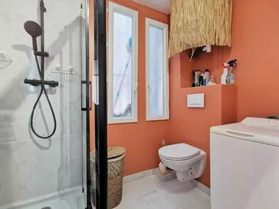 a bathroom with a shower and a toilet at Cosy Savoie by Bookking Guys in Nice