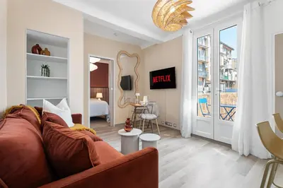 a living room with a couch and a bedroom at Nice Renting - 35b MASSENA - Chic Cosy Calm Balcony Massena Pedestrian Heart in Nice