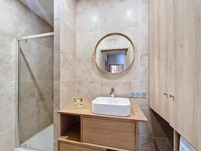 a bathroom with a sink and a mirror at Nestor&Jeeves - MAYA TERRASSE - Centre ville in Nice