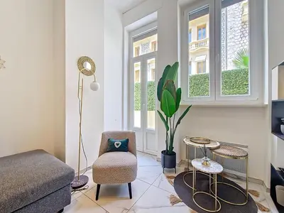 a living room with a couch and a chair at Nestor&Jeeves - OASIS - Terrace in the city in Nice