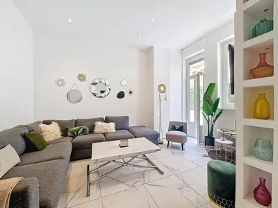 a living room with a couch and a table at Nestor&Jeeves - OASIS - Terrace in the city in Nice