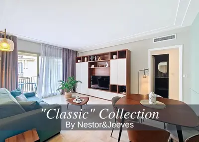 a living room with a couch and a table at Nestor&Jeeves - VICTORIA - Delux apartment city center in Nice