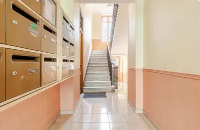 a hallway with a staircase in a building at Grand Studio Luxe in Nice