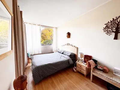 a bedroom with a bed and a window at Blue dream and zen Holidays in Nice
