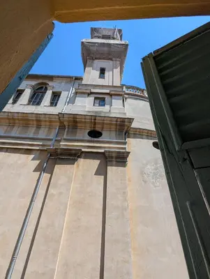 a tall building with a clock tower on top at Studio calme & climatisé - Quartier du Vieux-Nice animé proche plages & restos in Nice