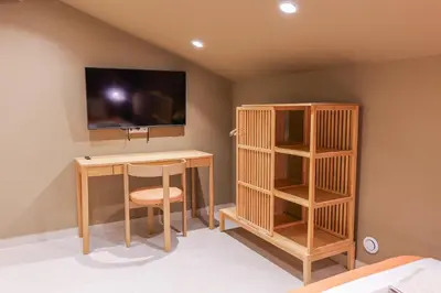 a room with a desk and a tv on a wall at Extra Spacious Modern Apartment HUB Nice Center in Nice