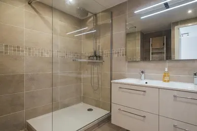 a bathroom with a shower and a sink at L'Authentic, charme dans la vieille ville avec climatisation in Nice