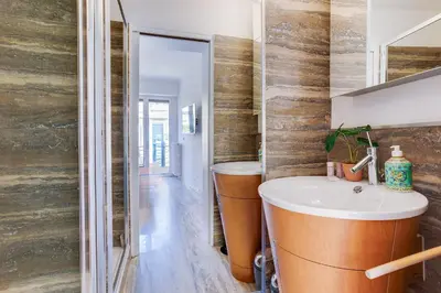 a bathroom with a sink and a mirror at PANORAMIC ESTEREL AP4475 By Riviera Holiday Homes in Villefranche-sur-Mer