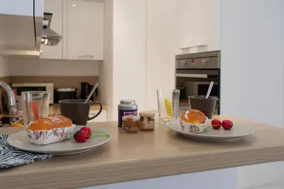 two plates of food on a counter in a kitchen at #56 2P Massena Central close promenade,Old Town, AC in Nice