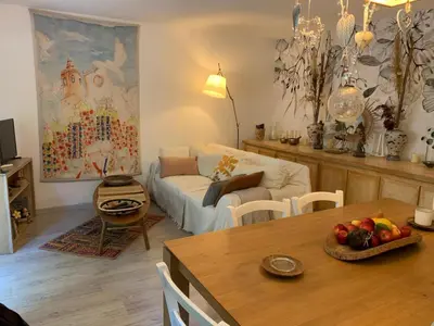 a living room with a couch and a table at L'Échappée Belle in Nice