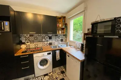 a kitchen with a washer and dryer in it at Beautiful apartment on the heights of Nice - Parking in Nice