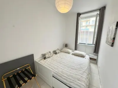 a white bedroom with a bed and a window at Ze Perfect Place - Centre - Durandy - 2 Chb - AC in Nice