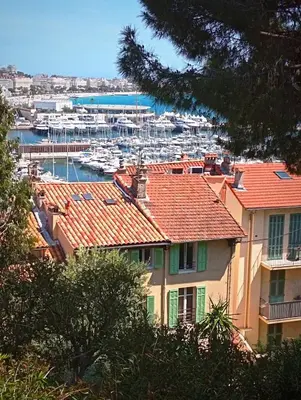 a view of a marina with boats in the water at Bohemian style and luminous balcony in Nice