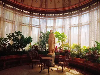 a statue of a woman in a room with plants at Bohemian style and luminous balcony in Nice