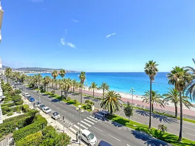 an aerial view of a street with palm trees and the ocean at Nice Seaview Loft Promenade in Nice