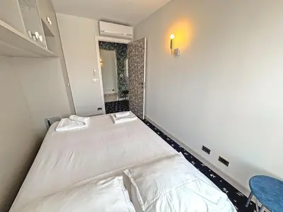 a small room with two beds in it at Panoramic Pebbles Azur in Nice