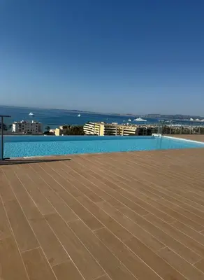 a swimming pool with a view of the ocean at Piscine Rooftop Résidence Neuve in Saint-Laurent-du-Var