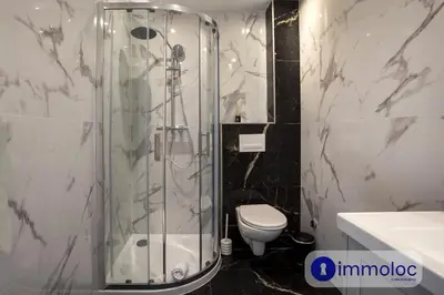a bathroom with a shower and a toilet at Air-conditioned apartment in the Carras district close to the sea in Nice