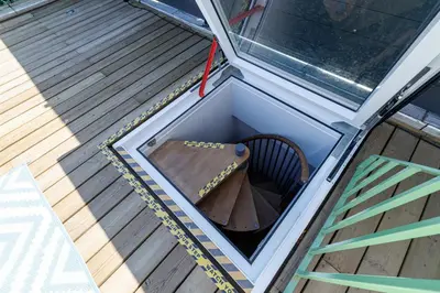 an inside view of a dog house with a table and a chair at Wide Open Sky Terrace 1 Bdr in Nice