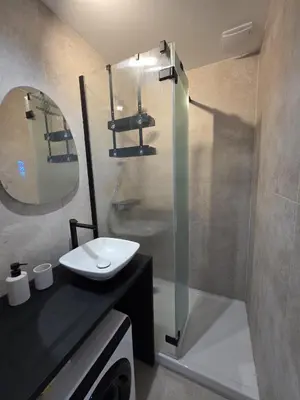 a bathroom with a sink and a shower at Magnifique appartement Carré Or in Nice