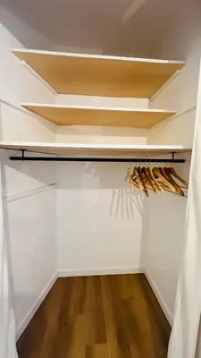 a walk in closet with white walls and wooden floors at Sublime T3 havre de paix rénové climatisé Parking in Nice