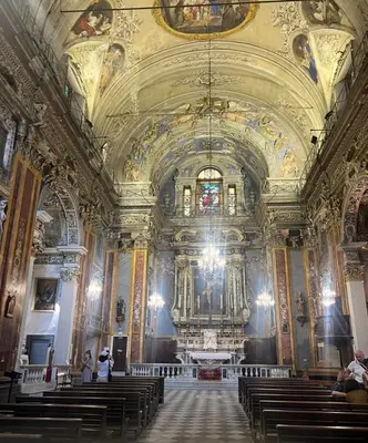 a large church with a large ceiling and pews at Rossetti in Nice