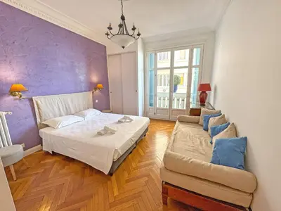 a bedroom with a bed and a couch at Belle Epoque Azur Promenade Nice in Nice