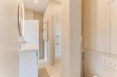 a bathroom with a sink and a shower at COCO BEACH AP4476 by Riviera Holiday Homes in Nice