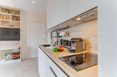 a kitchen with a sink and a counter top at COCO BEACH AP4476 by Riviera Holiday Homes in Nice