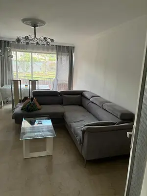 a living room with a couch and a table at Nice vauban in Nice