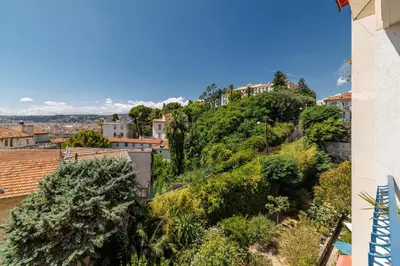 a view of a hill with trees and houses at Quiet & Open View - 1 Bdr Large Terrace in Nice