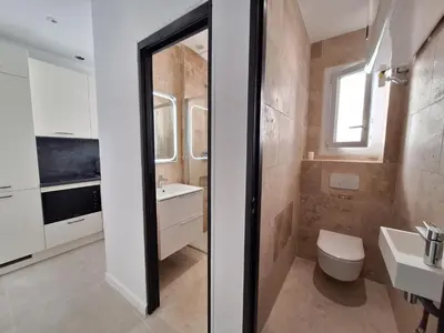a bathroom with a toilet and a sink at Iconic and bright style in Nice in Nice