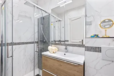 a bathroom with a sink and a shower at Amazing Sunset in Nice