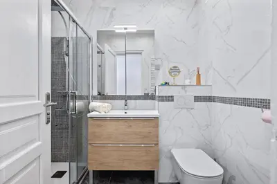 a bathroom with a toilet and a sink and a shower at Amazing Sunset in Nice