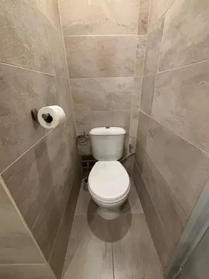 a bathroom with a toilet and a roll of toilet paper at Studio rénové à deux pas de la mer et commerces in Cagnes-sur-Mer
