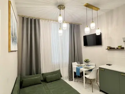 a living room with a couch and a table at Pearl of Nice in Nice